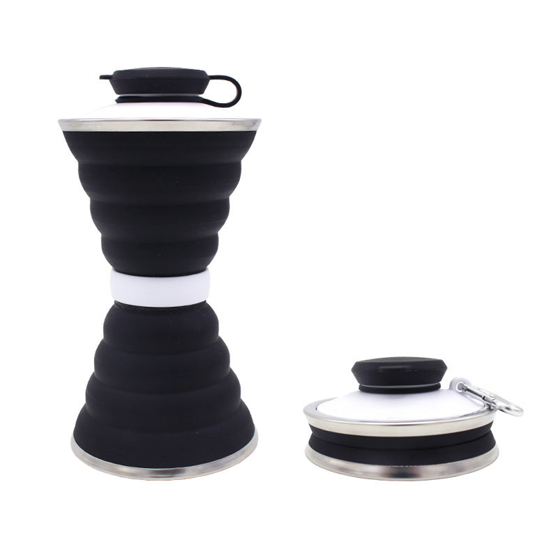 Black and white collapsible bottle with silicone sleeve on a white background