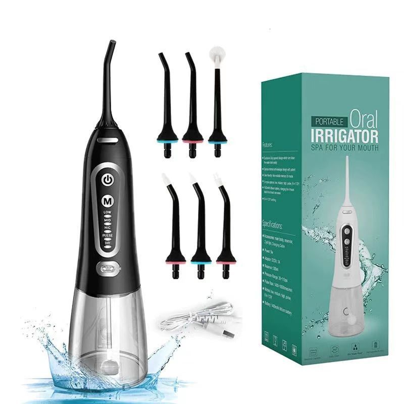 Black oral irrigator with multiple nozzles and packaging on a white background