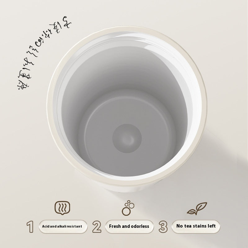 Close-up of a gray ceramic product with text and icons on a light background
