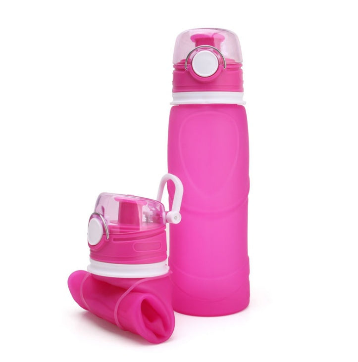Pink collapsible water bottle with white accents on a white background