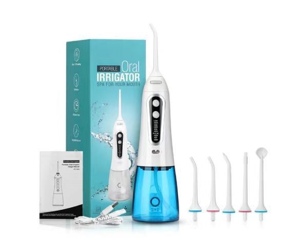 Portable oral irrigator with packaging and additional nozzles on a white background
