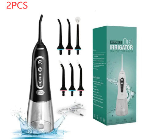 Portable oral irrigator with multiple nozzles and packaging on a white background