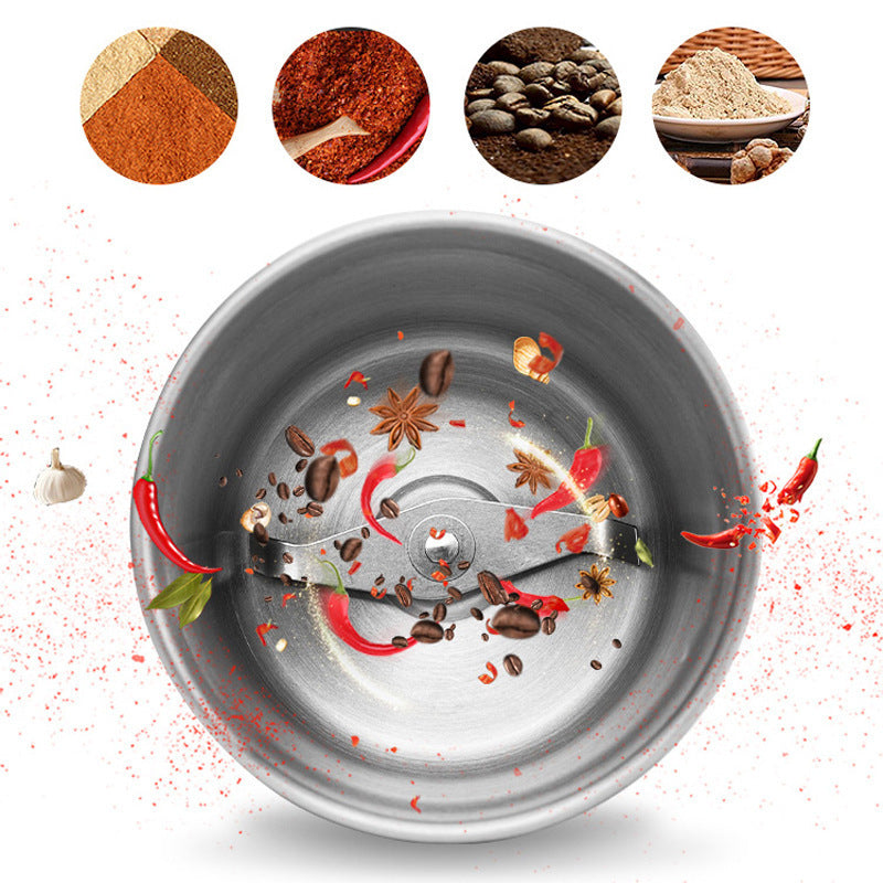 Spice grinder with spices and herbs on a white background