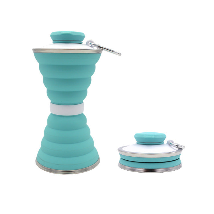 Teal collapsible bottle with silver base and cap on a white background