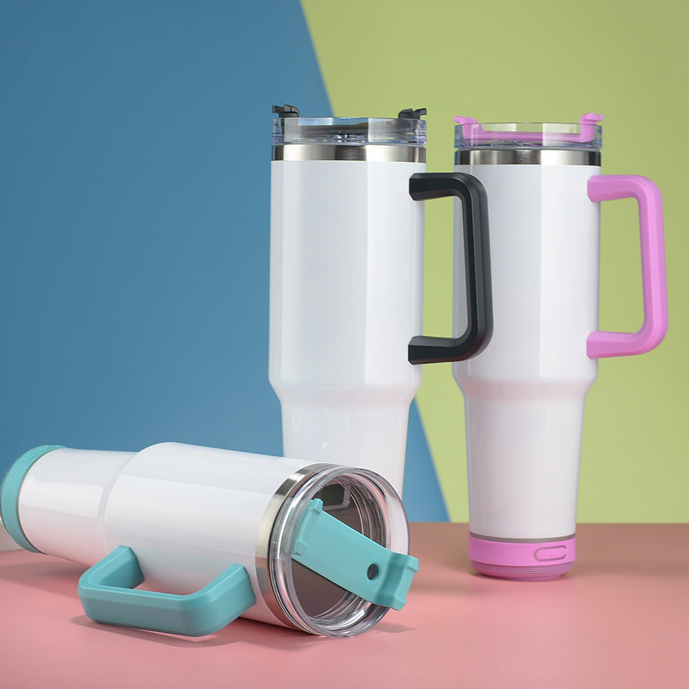 Three white tumblers with colorful handles on a multicolored background