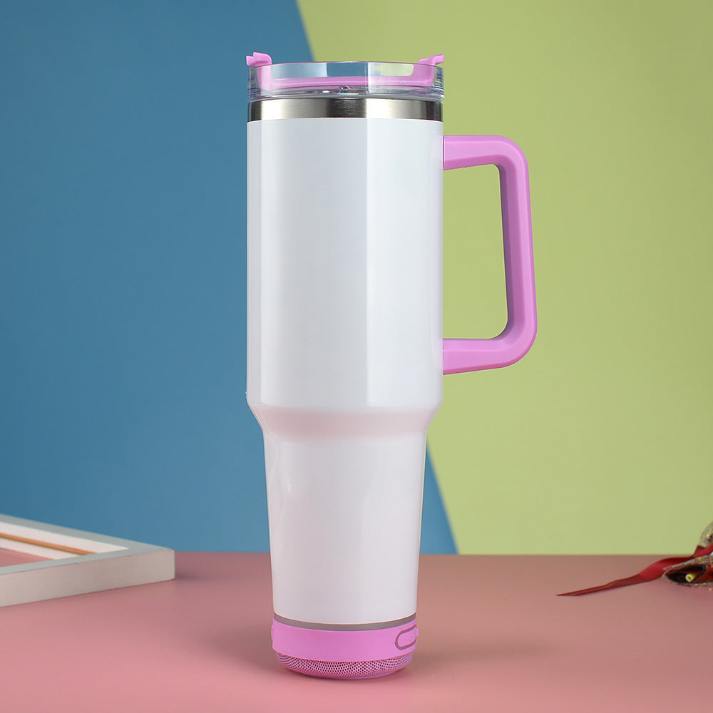 White tumbler with pink handle and accents on a colorful background