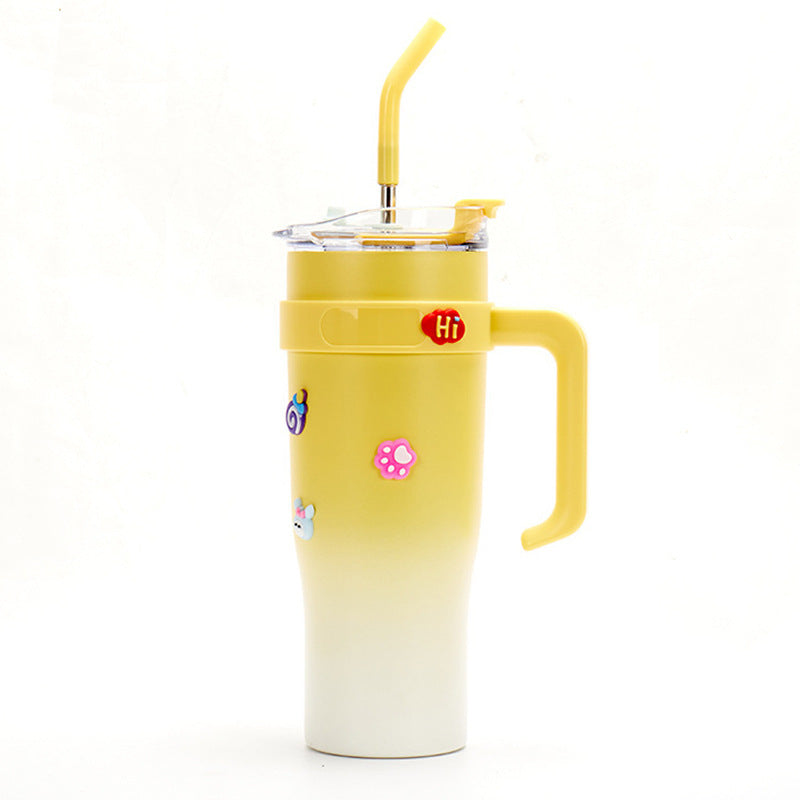Yellow gradient tumbler with a handle and straw on a white background