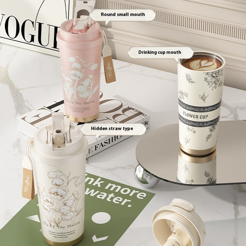 Set of floral-patterned tumblers on a surface with text labels.